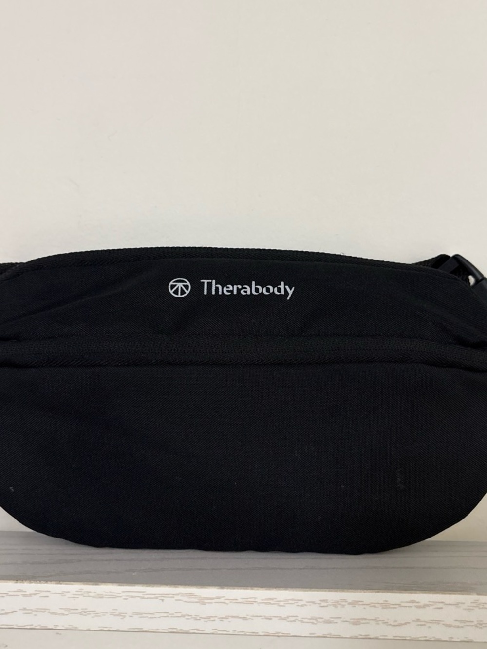 Therabody Black Waist Sling Bag with Subtle Logo